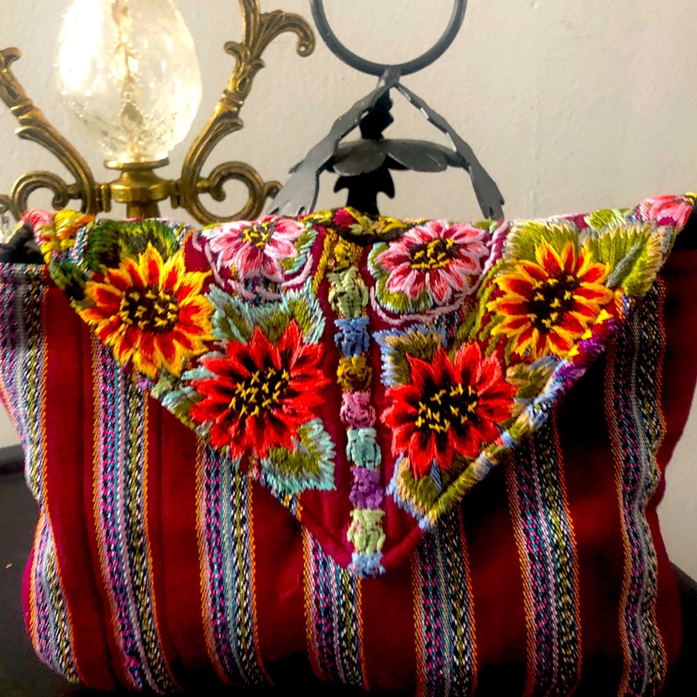 Hiptipico artisan clutch handmade. Detailed with stripes and floral embroidery